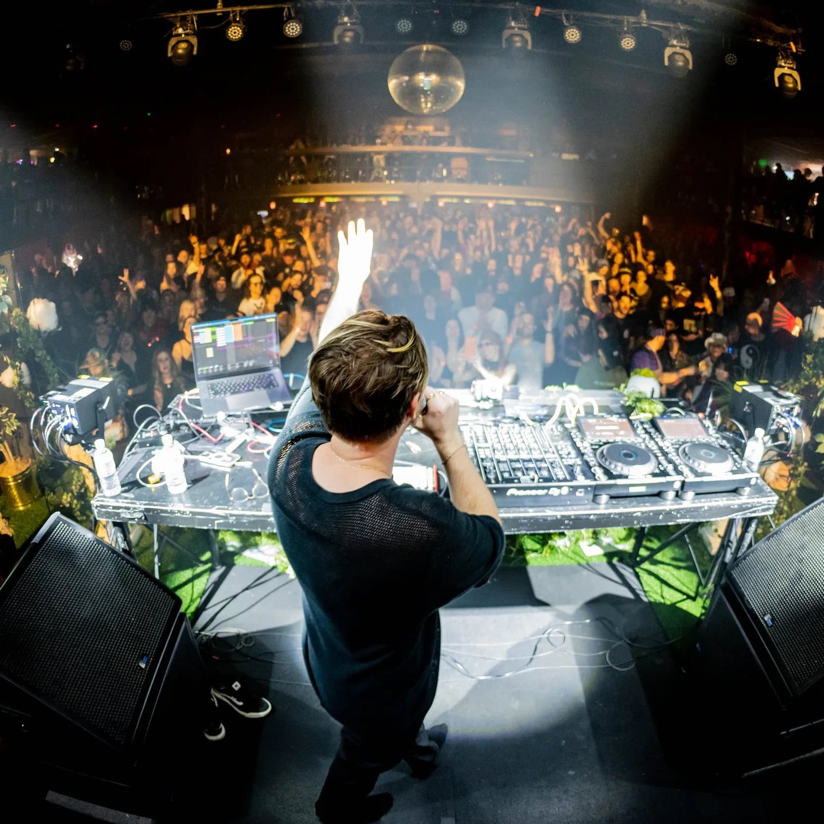 Skysia DJing to a festival crowd in daylight